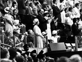 Queen Elizabeth, with Montreal Mayor Jean Drapeau, attends the opening of the 1976 Montreal Olympics.