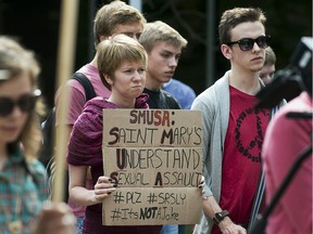 Students attend a rally at Saint Mary's University to express their concerns over a chant that promoted rape culture during a recent school activity, in Halifax on Thursday, Sept. 12, 2013. The chant, captured on video and posted on social media, was sung at a frosh-week event for about 400 new students at the school.