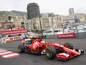 Ferrari driver Sebastian Vettel of Germany steers his car during the first practice session at the Monaco racetrack, in Monaco, Thursday, May 21, 2015.