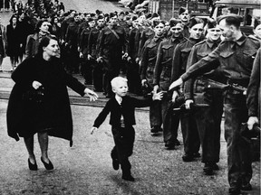 The famous photo "Wait for me, Daddy" shows Private Jack Bernard, B.C. Regiment (Duke of Connaught's Own Rifles) saying goodbye to his five-year-old son Warren Bernard as he leaves for the Second World War in New Westminster, B.C., 1940.