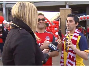 Shauna Hunt interviews a two Toronto FC soccer fans in Toronto on Sunday, May 10, 2015, in this video frame grab. A Toronto reporter is setting social media abuzz by fighting back against a controversial trend that sees men hurling obscenities at female journalists on the job. Shauna Hunt of CityNews was the latest woman to be heckled by a group of men shouting sexually explicit comments into her microphone as she tried to cover a local soccer game.