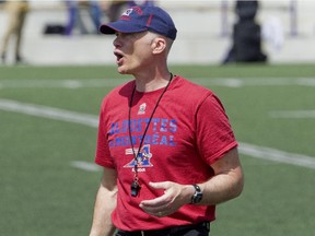 Alouettes head coach Tom Higgins gives instructions the first day of the team's training camp at Bishops University in Sherbrooke on June 1, 2014.