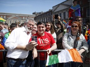 Sinn Fein president Gerry Adams meets Yes supporters at Dublin castle, Ireland, Saturday, May 23, 2015. Ireland has voted resoundingly to legalize gay marriage in the world's first national vote on the issue.