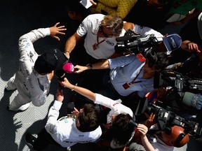 Mercedes F1 driver Lewis Hamilton of Great Britain speaks wtih members of the media after practice for the Spanish Grand Prix at Circuit de Catalunya on May 8, 2015 in Montmelo, Spain.