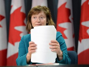 Suzanne Legault, Information Commissioner of Canada, holds a press conference in the National Press Theatre in Ottawa on Tuesday, March 31, 2015. Legault says the Conservative government is setting a perilous precedent by retroactively rewriting the law to absolve the RCMP of wrongdoing.