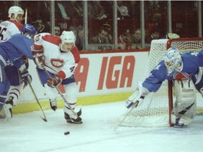 Brian Savage of the Montreal Canadiens tries to get the puck in front of the Quebec Nordiques' net during first period action at the forum on April 5, 1995.