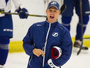 Tampa Bay Lightning head coach Jon Cooper gives instructions to players during practice at the Ice Sports Forum in Tampa, Fla, on May 11, 2015 as the club prepared to face the Canadiens in Game 6 of NHL Eastern Conference semifinal series.