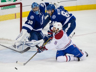 Montreal Canadiens right wing Brandon Prust attempts to get a rebound by Tampa Bay Lightning goalie Ben Bishop and Tampa Bay Lightning defenseman Nikita Nesterov during the first period of Game 6 of their NHL Eastern Conference semifinal series at Amalie Arena in Tampa, Fla., on Tuesday, May 12, 2015.