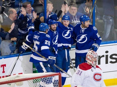 Tampa Bay Lightning centre Steven Stamkos, top second from right, celebrates with teammates after scoring a goal on Montreal Canadiens goalie Carey Price during the second period of Game 6 of their NHL Eastern Conference semifinal series at Amalie Arena in Tampa, Fla., on Tuesday, May 12, 2015.