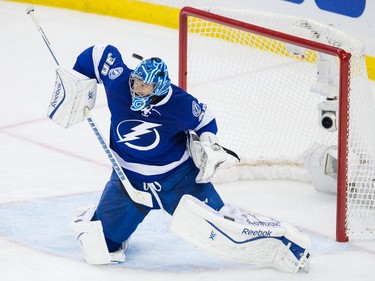 Tampa Bay Lightning goalie Ben Bishop deflects a puck during the second period of Game 6 of their NHL Eastern Conference semifinal series against the Montreal Canadiens at Amalie Arena in Tampa, Fla., on Tuesday, May 12, 2015.