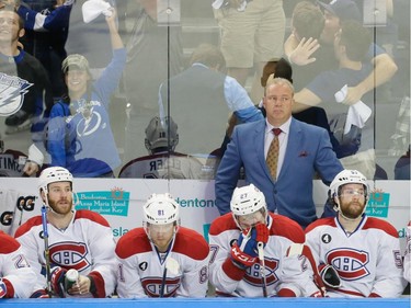 Montreal Canadiens head coach Michel Therrien, top, and players react to the game-winning goal in the last second of play by Tampa Bay Lightning centre Tyler Johnson, not pictured, during the third period of game three of their NHL eastern conference semi-final hockey series at Amalie Arena in Tampa on Wednesday, May 6, 2015.
