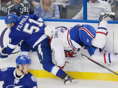Montreal Canadiens right wing Devante Smith-Pelly, right, collides with Tampa Bay Lightning centre Valtteri Filppula, left, during the third period of game three of their NHL eastern conference semi-final hockey series at Amalie Arena in Tampa on Wednesday, May 6, 2015.