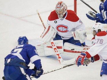 Tampa Bay Lightning centre Alex Killorn, left, scores on Montreal Canadiens goalie Carey Price, centre, as Canadiens defenceman P.K. Subban, right, attempts to stop the shot during the first period of game three of their NHL eastern conference semi-final hockey series at Amalie Arena in Tampa on Wednesday, May 6, 2015.
