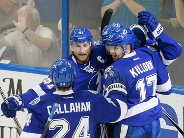 Tampa Bay Lightning centre Alex Killorn, right, celebrates with teammates after scoring on Montreal Canadiens goalie Carey Price, not pictured, during the first period of game three of their NHL eastern conference semi-final hockey series at Amalie Arena in Tampa on Wednesday, May 6, 2015.
