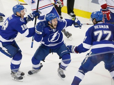 Tampa Bay Lightning centre Tyler Johnson, centre, celebrates his game-winning goal during the last second of play with teammates Ondrej Palat, left, and Victor Hedman, right, during the third period of game three of their NHL eastern conference semi-final hockey series against the Montreal Canadiens at Amalie Arena in Tampa on Wednesday, May 6, 2015.