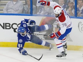 Tampa Bay Lightning centre Valtteri Filppula, left, falls after colliding with Montreal Canadiens defenceman P.K. Subban, right, during the first period of game three of their NHL eastern conference semi-final hockey series at Amalie Arena in Tampa on Wednesday, May 6, 2015.