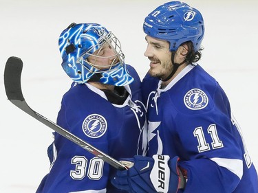 Tampa Bay Lightning goalie Ben Bishop, left, is congratulated by Tampa Bay Lightning centre Brian Boyle, right, after winning game three of their NHL eastern conference semi-final hockey series against the Montreal Canadiens at Amalie Arena in Tampa on Wednesday, May 6, 2015.