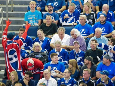 A Montreal Canadiens waves to Tampa Bay Lightning fans during the second period of game four of the NHL eastern conference semi-final hockey series between the Montreal Canadiens and the Tampa Bay Lightning at Amalie Arena in Tampa on Thursday, May 7, 2015.