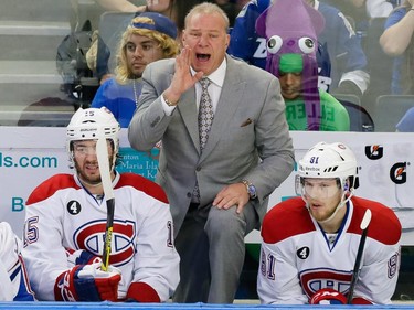 Montreal Canadiens head coach Michel Therrien, centre, yells as Canadiens right wing P.A. Parenteau, left, and centre Lars Eller, right, sit in the bench during the second period of game four of their NHL eastern conference semi-final hockey series against the Tampa Bay Lightning at Amalie Arena in Tampa on Thursday, May 7, 2015.