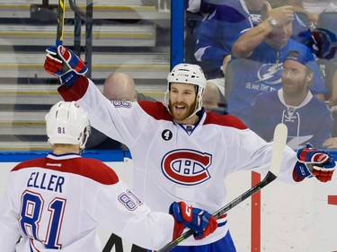 Montreal Canadiens right wing Brandon Prust, right, celebrates his goal with teammate  centre Lars Eller, left, during the third period of game four of their NHL eastern conference semi-final hockey series against the Tampa Bay Lightning at Amalie Arena in Tampa on Thursday, May 7, 2015.