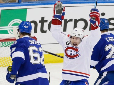Montreal Canadiens right wing Brendan Gallagher, right, celebrates the goal of teammate Andrei Markov, not pictured, during the first period of game four of their NHL eastern conference semi-final hockey series against the Tampa Bay Lightning at Amalie Arena in Tampa on Thursday, May 7, 2015.