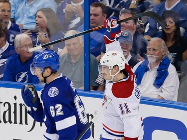 Montreal Canadiens right wing Brendan Gallagher, right, celebrates his goal as Tampa Bay Lightning defenceman Andrej Sustr, left, skates past during the second period of game four of their NHL eastern conference semi-final hockey series at Amalie Arena in Tampa on Thursday, May 7, 2015.