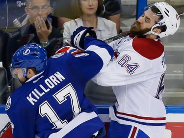 Tampa Bay Lightning centre Alex Killorn, left, collides with Montreal Canadiens defenceman Greg Pateryn, right, during the third period of game four of their NHL eastern conference semi-final hockey series at Amalie Arena in Tampa on Thursday, May 7, 2015.