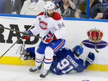 Tampa Bay Lightning centre Steven Stamkos, bottom, falls after colliding with Montreal Canadiens defenceman Greg Pateryn, top, during the second period of game four of their NHL eastern conference semi-final hockey series at Amalie Arena in Tampa on Thursday, May 7, 2015.