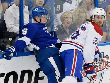 Tampa Bay Lightning left wing Ondrej Palat, left, collides with Montreal Canadiens defenceman Jeff Petry, right, during the second period of game four of their NHL eastern conference semi-final hockey series at Amalie Arena in Tampa on Thursday, May 7, 2015.