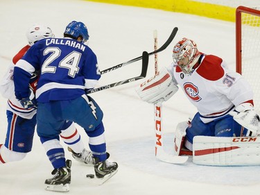 Tampa Bay Lightning right wing Ryan Callahan, left, attempts a shot against Montreal Canadiens goalie Carey Price, right, during the first period of game four of their NHL eastern conference semi-final hockey series at Amalie Arena in Tampa on Thursday, May 7, 2015.