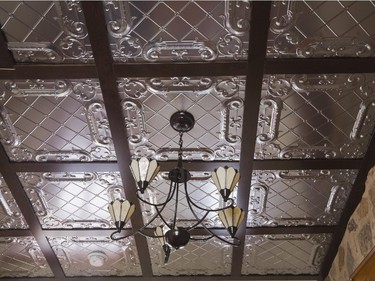 The ceiling in the vestibule of the extension was designed with stamped tin metal details.