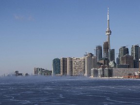 The Toronto skyline is pictured with a frozen section of Lake Ontario on Tuesday January 7, 2014.