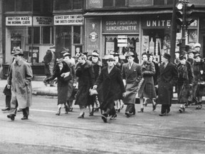 Pedestrians cross Ste-Catherine St. in this undated photo, probably from the 1940s or 1950s.