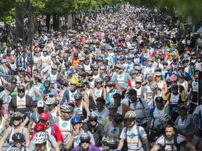 Thousands of cyclists wait to participate in the annual Tour de l'Ile at Parc La Fontaine in Montreal , Sunday, June 1, 2014.