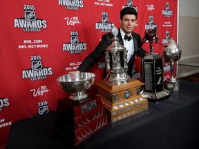 Canadiens goaltender Carey Price poses after winning (from left) the Jennings Trophy, Vézina Trophy, Ted Lindsay Award and the Hart Memorial Trophy at the 2015 NHL Awards at MGM Grand Garden Arena on June 24, 2015 in Las Vegas.