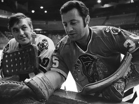 Chicago Blackhawks goaltenders Tony Esposito (right) and Denis DeJordy take a break during practice at the Montreal Forum in December 1969.