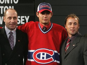 Carey Price poses with general manager Bob Gainey (left) and director of player personnel Trevor Timmins after being selected by the Canadiens with the No. 5 overall pick at the 2005 NHL Draft in Ottawa.