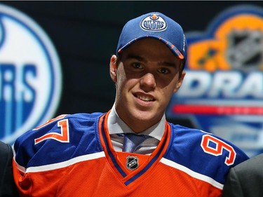 Connor McDavid poses on stage after being selected first overall by the Edmonton Oilers in the first round of the 2015 NHL Draft on June 26, 2015 in Sunrise, Florida.