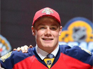 Lawson Crouse poses after being selected eleventh overall by the Florida Panthers in the first round of the 2015 NHL Draft on June 26, 2015 in Sunrise, Florida.