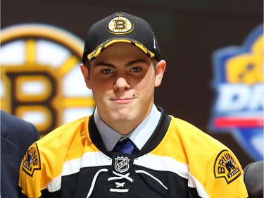 Jake DeBrusk poses after being selected 14th overall by the Boston Bruins in the first round of the 2015 NHL Draft on June 26, 2015 in Sunrise, Florida.