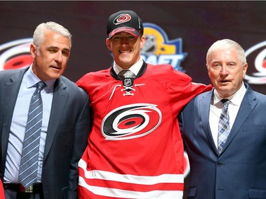 Noah Hanifin poses after being selected fifth overall by the Carolina Hurricanes in the first round of the 2015 NHL Draft on June 26, 2015 in Sunrise, Florida.
