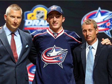 Zach Werenski poses after being selected eighth overall by the Columbus Blue Jackets in the first round of the 2015 NHL Draft on June 26, 2015 in Sunrise, Florida.