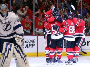 Brandon Saad #20 of the Chicago Blackhawks celebrates with teammates after scoring a goal in the third period against Andrei Vasilevskiy #88 of the Tampa Bay Lightning during Game Four of the 2015 NHL Stanley Cup Final at the United Center on June 10, 2015 in Chicago, Illinois.