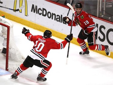 Jonathan Toews #19 celebrates his second period goal with Patrick Sharp #10 of the Chicago Blackhawks against the Tampa Bay Lightning during Game Four of the 2015 NHL Stanley Cup Final at the United Center on June 10, 2015 in Chicago, Illinois.