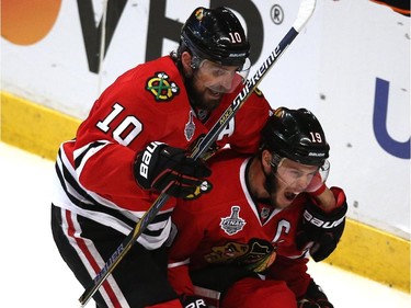 Jonathan Toews #19 celebrates his second period goal with Patrick Sharp #10 of the Chicago Blackhawks against the Tampa Bay Lightning during Game Four of the 2015 NHL Stanley Cup Final at the United Center on June 10, 2015 in Chicago, Illinois.