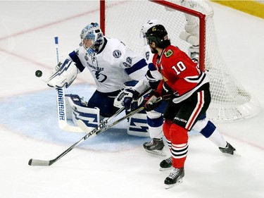 Andrei Vasilevskiy #88 of the Tampa Bay Lightning makes a save against Patrick Sharp #10 of the Chicago Blackhawks in the second period during Game Four of the 2015 NHL Stanley Cup Final at the United Center on June 10, 2015 in Chicago, Illinois.