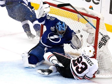 Kris Versteeg #23 of the Chicago Blackhawks crashes into the net against Ben Bishop #30 of the Tampa Bay Lightning during Game One of the 2015 NHL Stanley Cup Final at Amalie Arena on June 3, 2015 in Tampa, Florida.