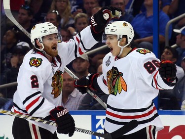 Teuvo Teravainen #86 celebrates his third period goal with Duncan Keith #2 of the Chicago Blackhawks against the Tampa Bay Lightning during Game One of the 2015 NHL Stanley Cup Final at Amalie Arena on June 3, 2015 in Tampa, Florida.
