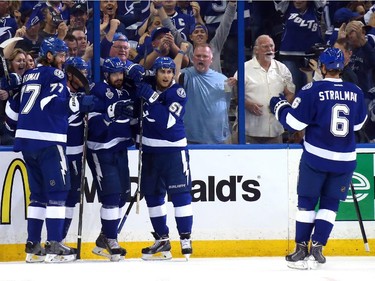Alex Killorn (#17) of the Tampa Bay Lightning celebrates his first period goal with teammates against the Chicago Blackhawks during Game One of the 2015 NHL Stanley Cup Final at Amalie Arena on June 3, 2015 in Tampa, Florida.
