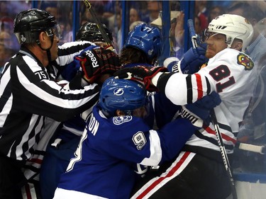 Tyler Johnson #9 of the Tampa Bay Lightning fights with Marian Hossa #81 of the Chicago Blackhawks during the first period in Game One of the 2015 NHL Stanley Cup Final at Amalie Arena on June 3, 2015 in Tampa, Florida.